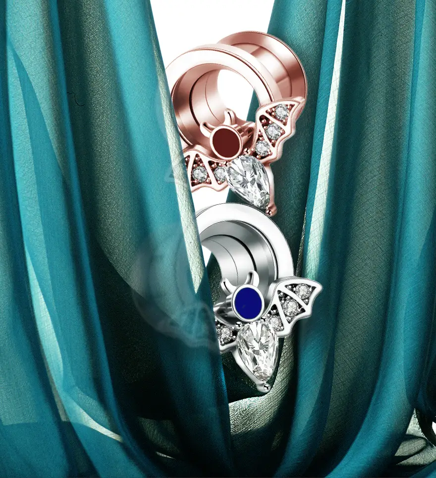 18K Rose Gold Red Enamel Round and Pear-Cut Diamond Bat Ear Tunnels. 18K White Gold Blue Enamel Round and Pear-Cut Diamond Bat Ear Tunnels. Plugs and Tunnels. US