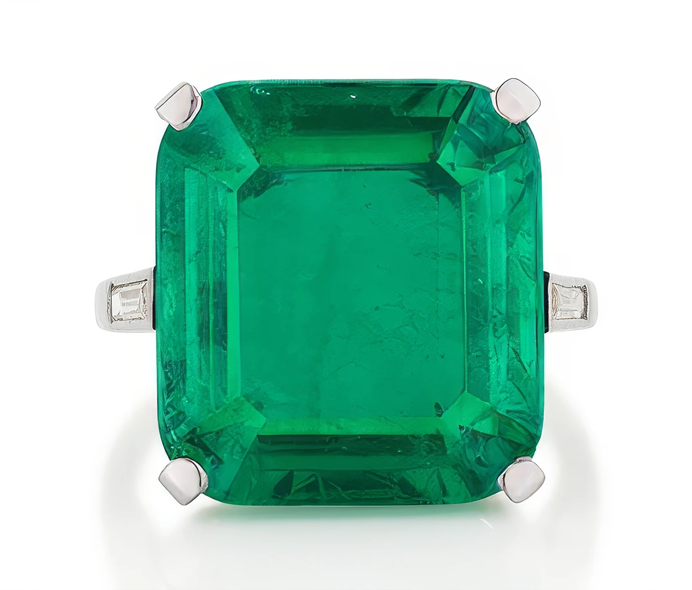 Top view of 14.65 carat emerald and diamond Cartier ring. Phillips Geneva Sale to Feature 6M Dollars Blue Diamond, Rare Emeralds, and Ruby Masterpieces. US