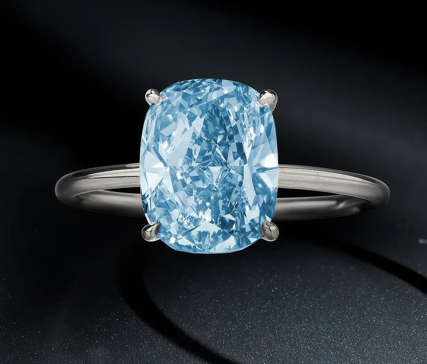 Top view of 3.24-carat fancy-vivid-blue diamond ring. Phillips Geneva Sale to Feature 6M Dollars Blue Diamond, Rare Emeralds, and Ruby Masterpieces. US