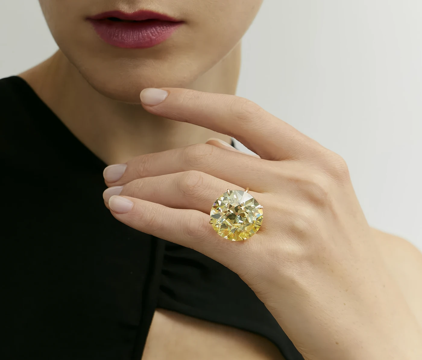 40.54-carat fancy yellow diamond ring on the finger. Phillips Geneva Sale to Feature 6M Dollars Blue Diamond, Rare Emeralds, and Ruby Masterpieces. US