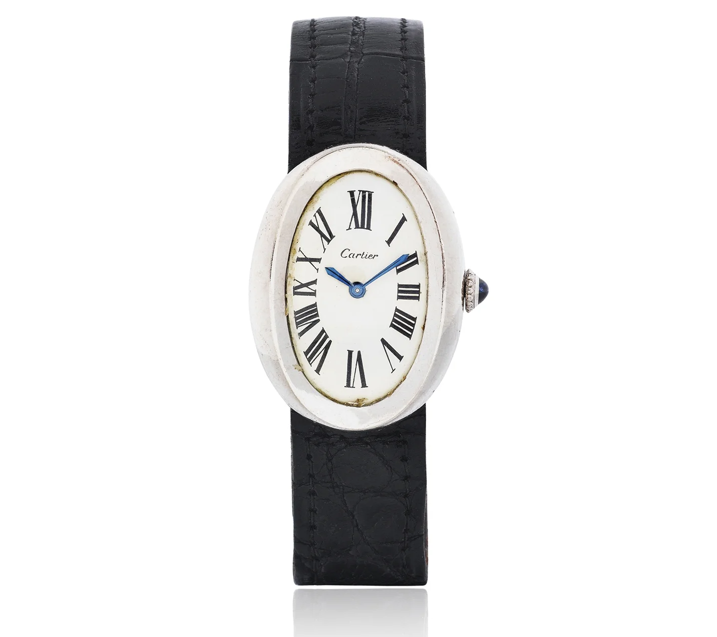 Baignoire de Cartier watch. white gokd set with a sapphire cabochon, blued-steel sword-shaped hands, sapphire crystal. Historic Jewelry Auction Astounds Everyone with Shirley Bassey’s Glamorous Collection. US