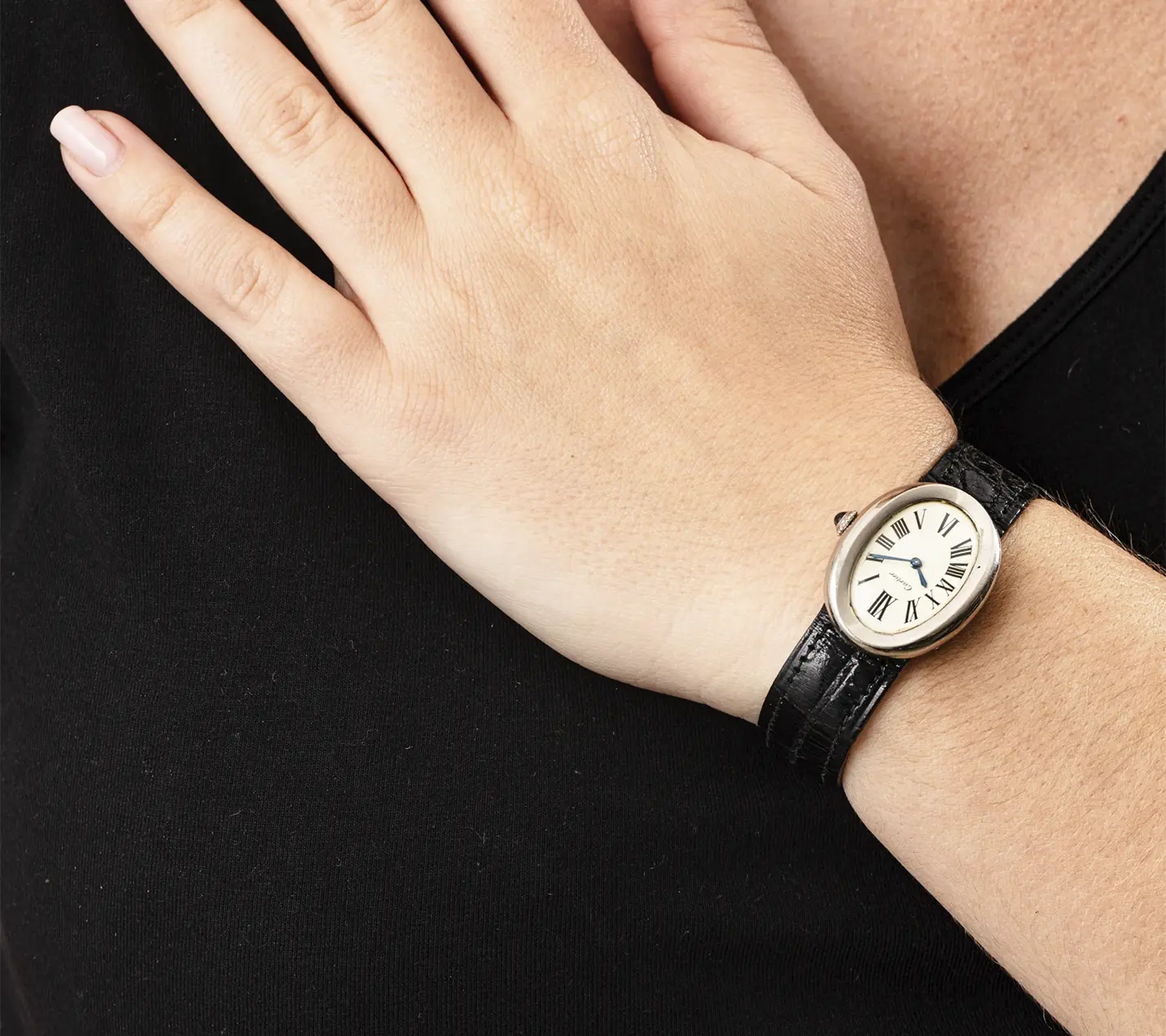 White gold oval Cartier “Baignoire” on a wrist. Historic Jewelry Auction Astounds Everyone with Shirley Bassey’s Glamorous Collection. US