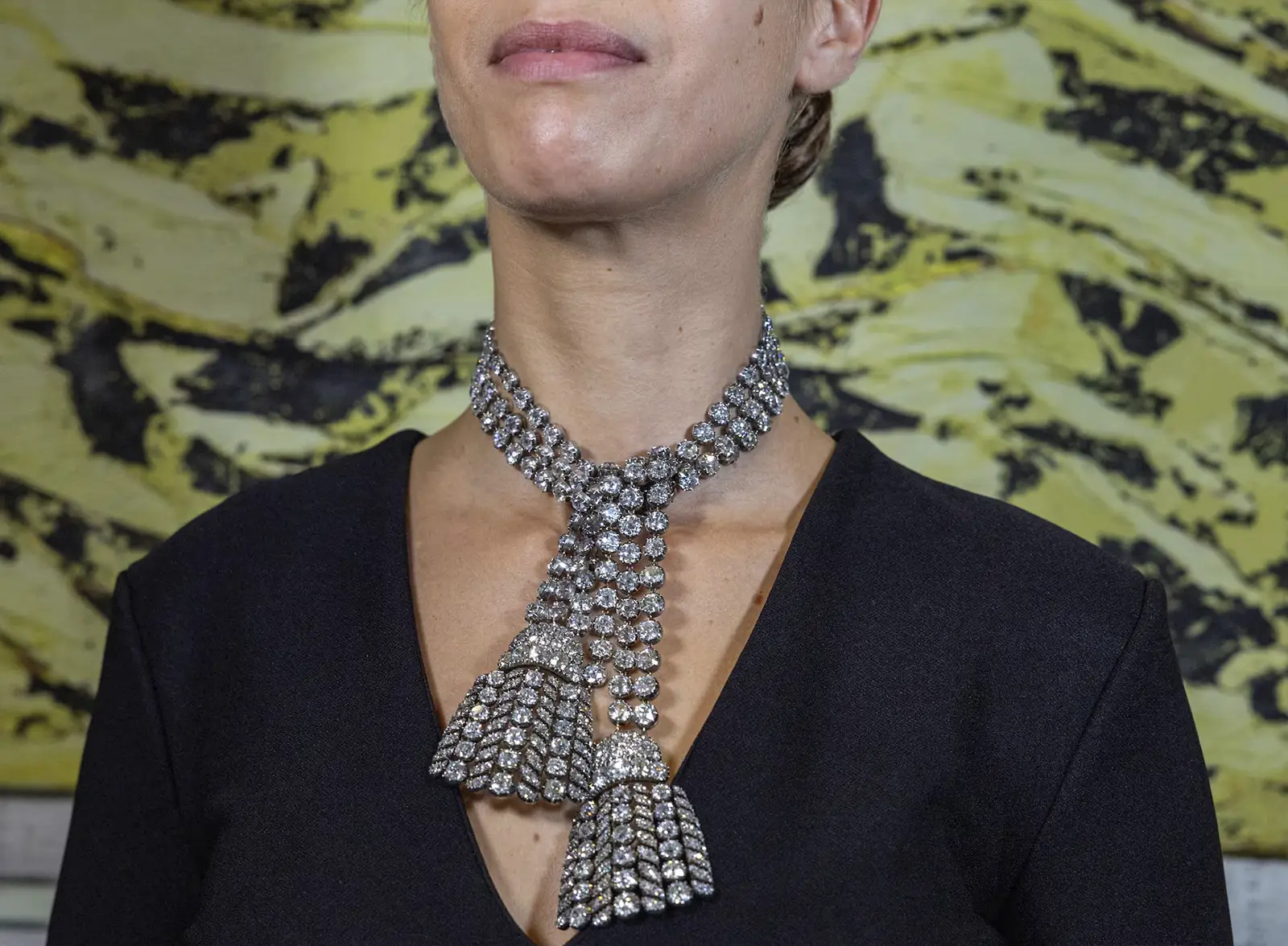 Woman is wearing a diamond necklace tied in the middle. .81 Million for Marie Antoinette’s Necklace or Why Historic Jewels Dominate Modern Auctions. US