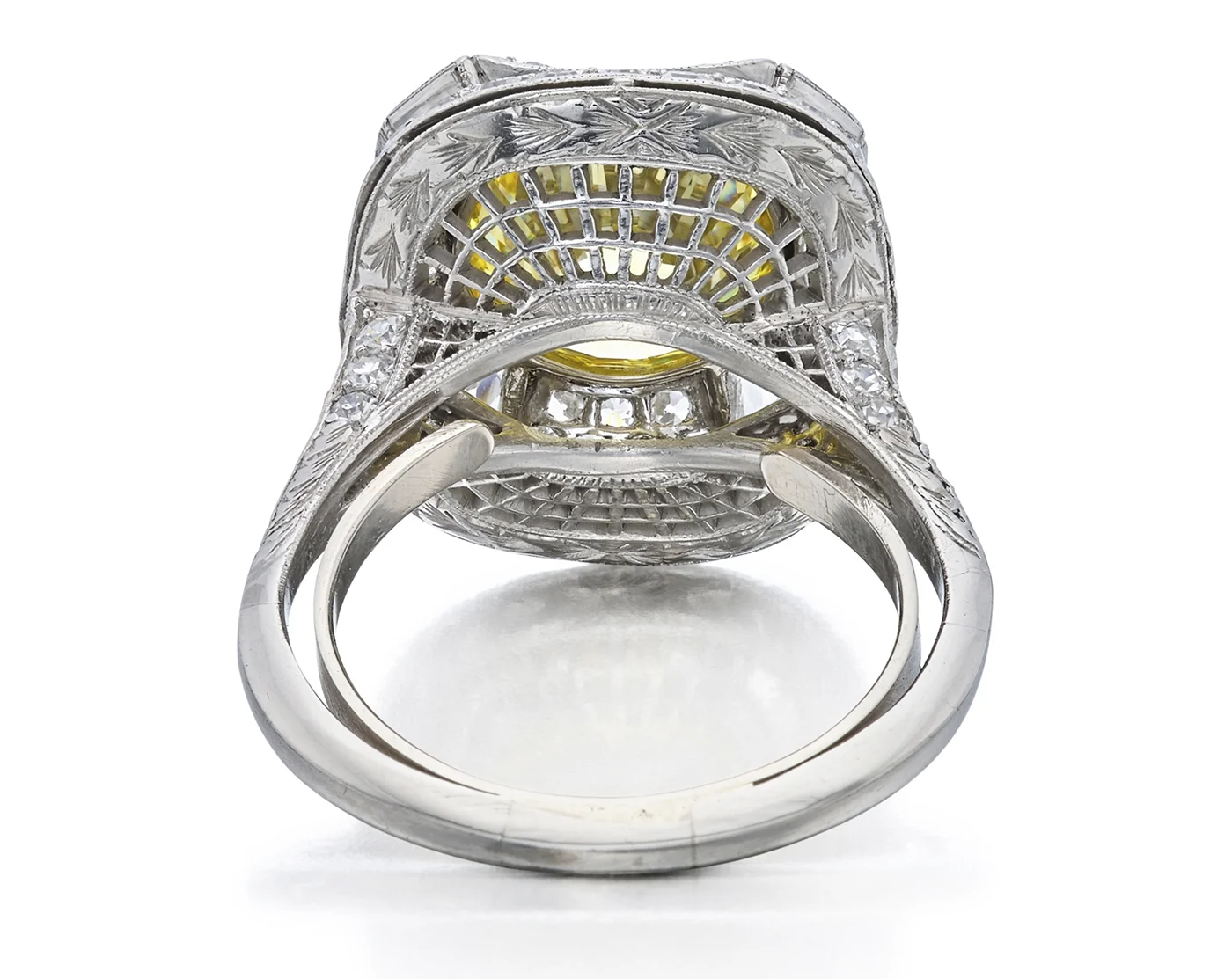 White gold 4.21ct ring that features a fancy vivid yellow VVS1 clarity main diamond. Bottom view. Sotheby’s Winter Auction Shines with Iconic Jewelry and Charitable Contributions. US