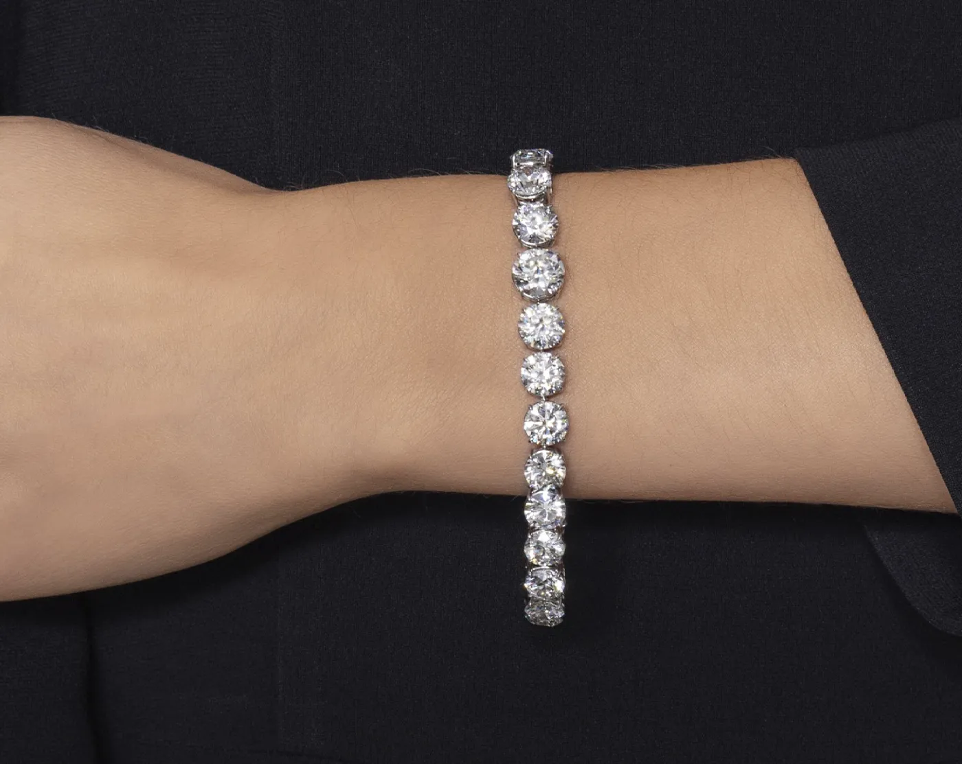 Diamond bracelet on the hand completely colorless diamonds ranging from 1.01 to 2.42 ct. Sotheby’s Winter Auction Shines with Iconic Jewelry and Charitable Contributions. US