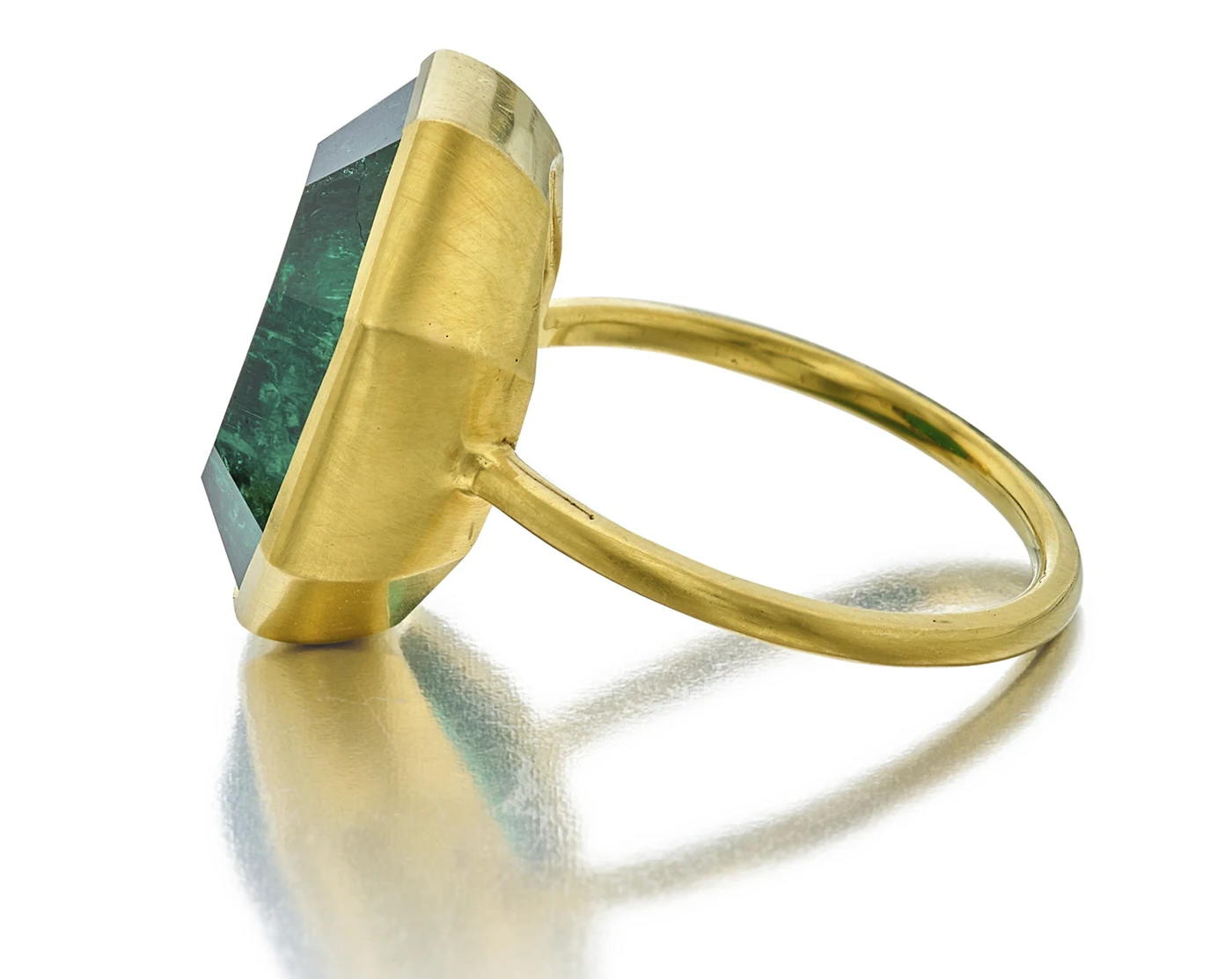 Yellow gold bezel set octagonal-shaped step cut 10.97 carat emerald ring. Sotheby’s Winter Auction Shines with Iconic Jewelry and Charitable Contributions. US