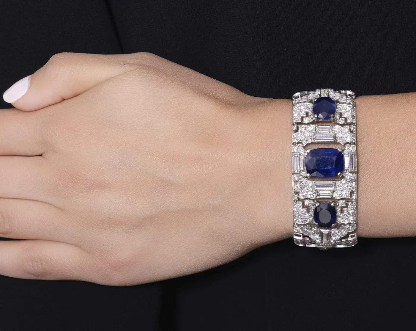 1927 Cartier Sapphire and Diamond bracelet on a womans hand. Luxury Auction in Saudi Arabia: Jewelry Struggles as Fine Art Dominates. News