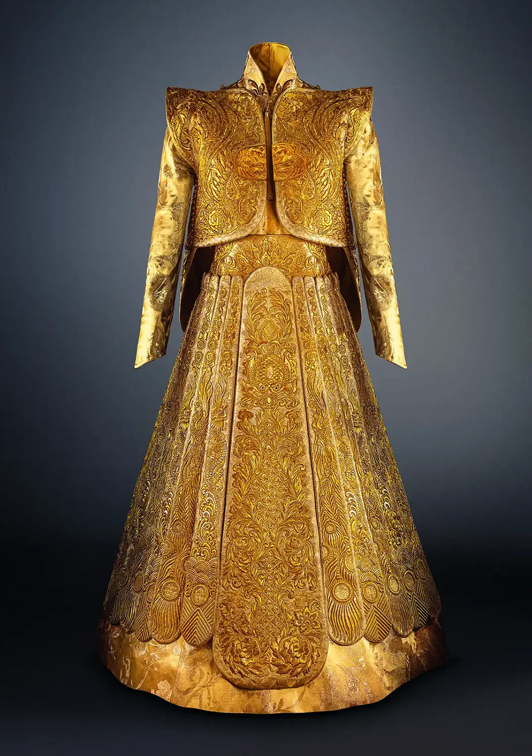 A traditional gold Chinese bridal gown by Guo Pei. Woven in Gold: Paris Show Traces the History of Gilded Fashion. News