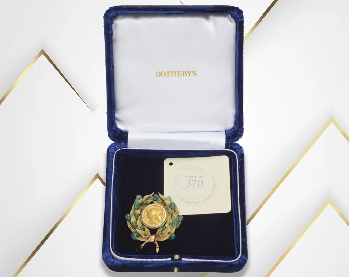 Gold emerald brooch in the box. Gold emerald brooch Stunning Brooch of Jacqueline Kennedy Stuns at Auction. News