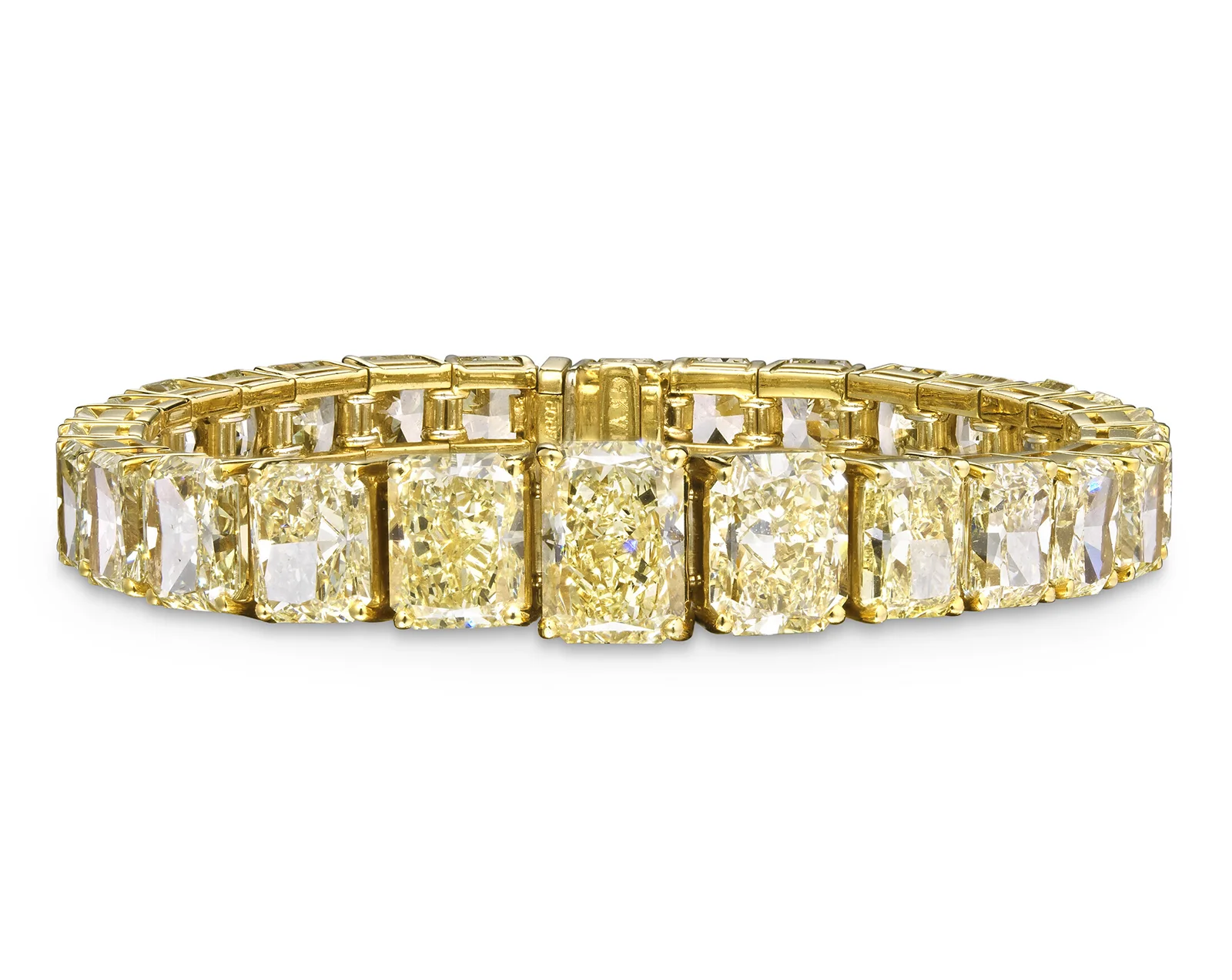Perspective view of a bracelet. This bracelet has 28 diamonds with a total weight of almost 47 carats. The largest diamond in the center weighs 4.07 carats. It was sold for HKD 2.4 million (308,758 dollars), within the expected price range. Graff Coloured Diamond Bracelet. Christie’s Auction Sees Big Sales for Diamond and Ruby Jewelry. News
