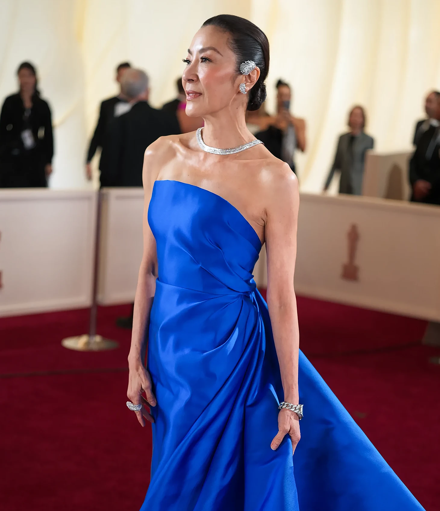 Michelle Yeoh. Boucheron Plume de Paon diamond ear piece and Quatre Radiant Edition tie necklace. The 6 Most Stunning Jewelry Moments from the 2025 Oscars—For Both Women & Men. News