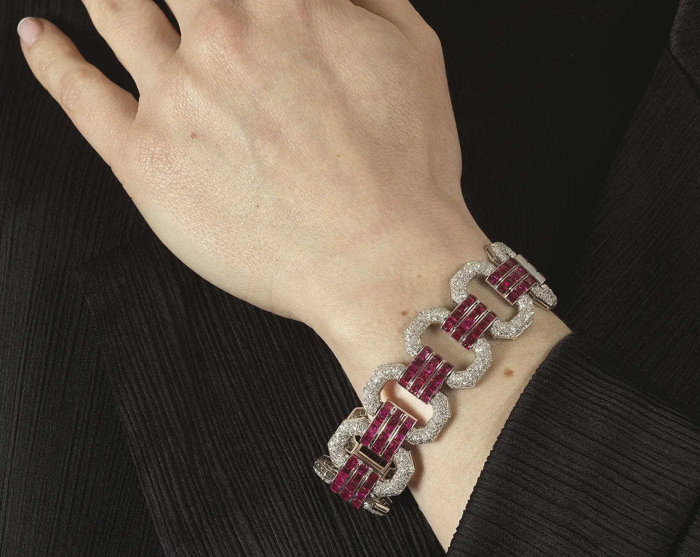 Bonhams Brings the Past to Life with Chaumet’s Hidden Jewels. News | Olertis 18 karat gold Chaumet Art Deco Ruby and Diamond Bracelet on a woman's hand. Bonhams Brings the Past to Life with Chaumet’s Hidden Jewels. News