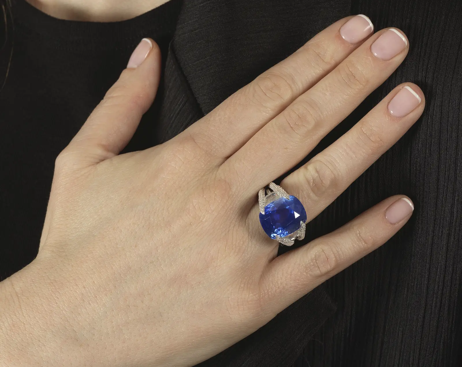 Bonhams Brings the Past to Life with Chaumet’s Hidden Jewels. News | Olertis Sapphire And Diamond Ring holding a 21.03 carat blue sapphire from Sri-Lanka. Ring on a girls finger. Bonhams Brings the Past to Life with Chaumet’s Hidden Jewels. News