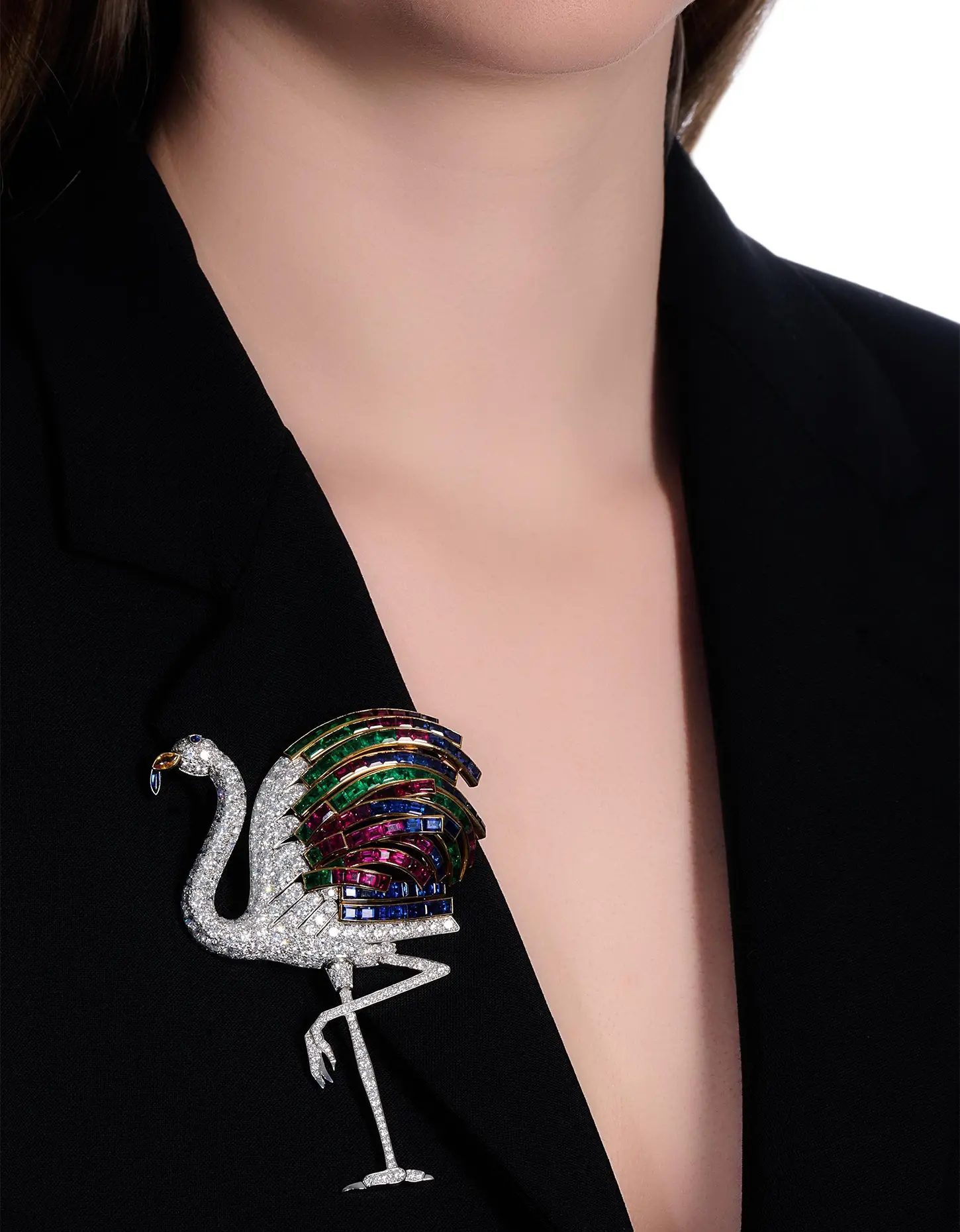Cartier at the V&A: Where Queens, Heiresses, and Hollywood Legends Meet in Jewels. News The Duchess of Windsor's-rubies sapphires emeralds diamonds Cartier Flamingo brooch. Brooch on a jacket. Cartier at the V&A: Where Queens, Heiresses, and Hollywood Legends Meet in Jewels. News
