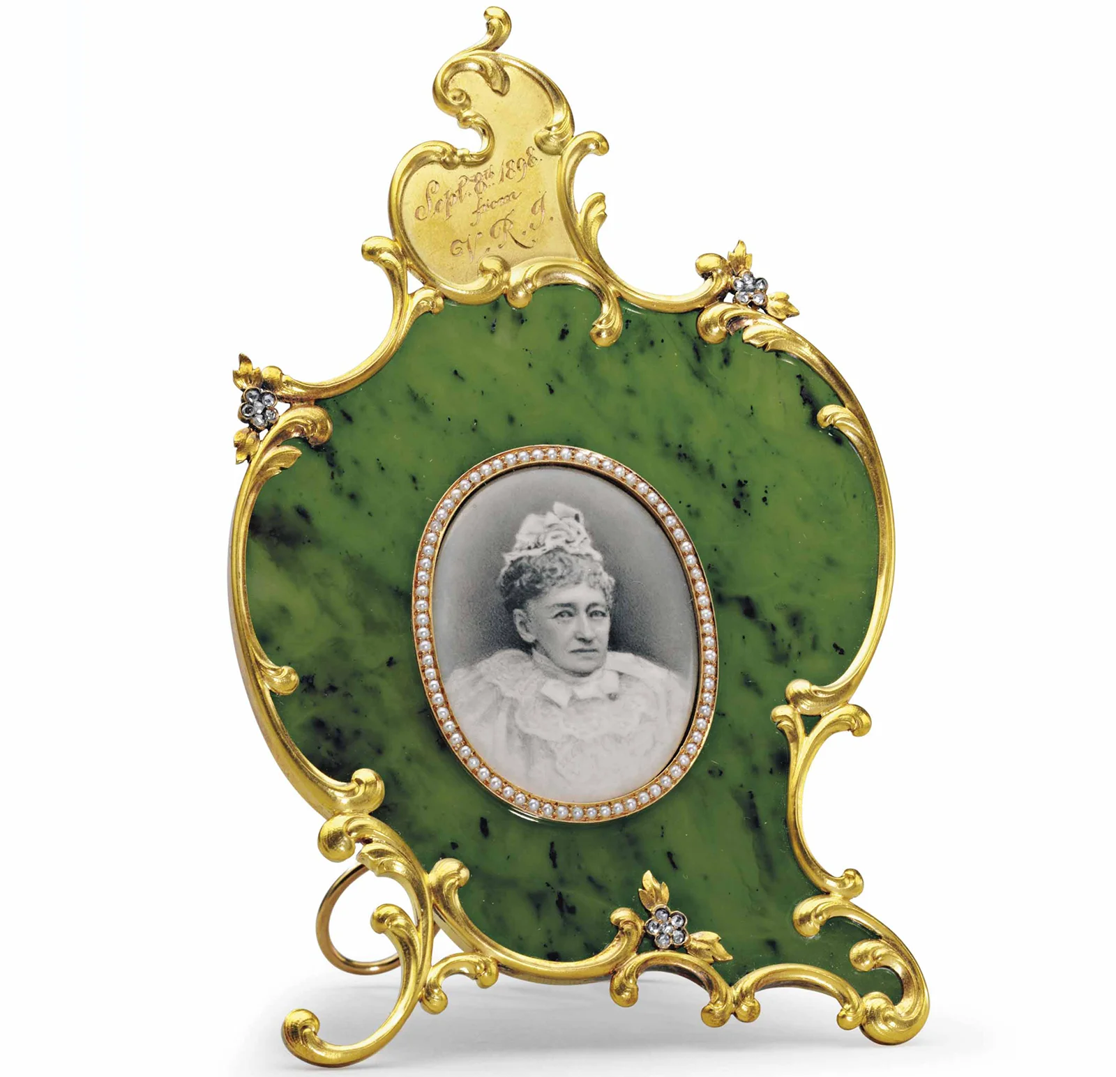 A Glimpse into Joan Rivers’ Jewelry Collection: Was It Really Worth 2.5 Million dollars? News | Olertis A luxurious nephrite photograph frame with gold and gemstone details. A Glimpse into Joan Rivers’ Jewelry Collection: Was It Really Worth 2.5 Million dollars? News