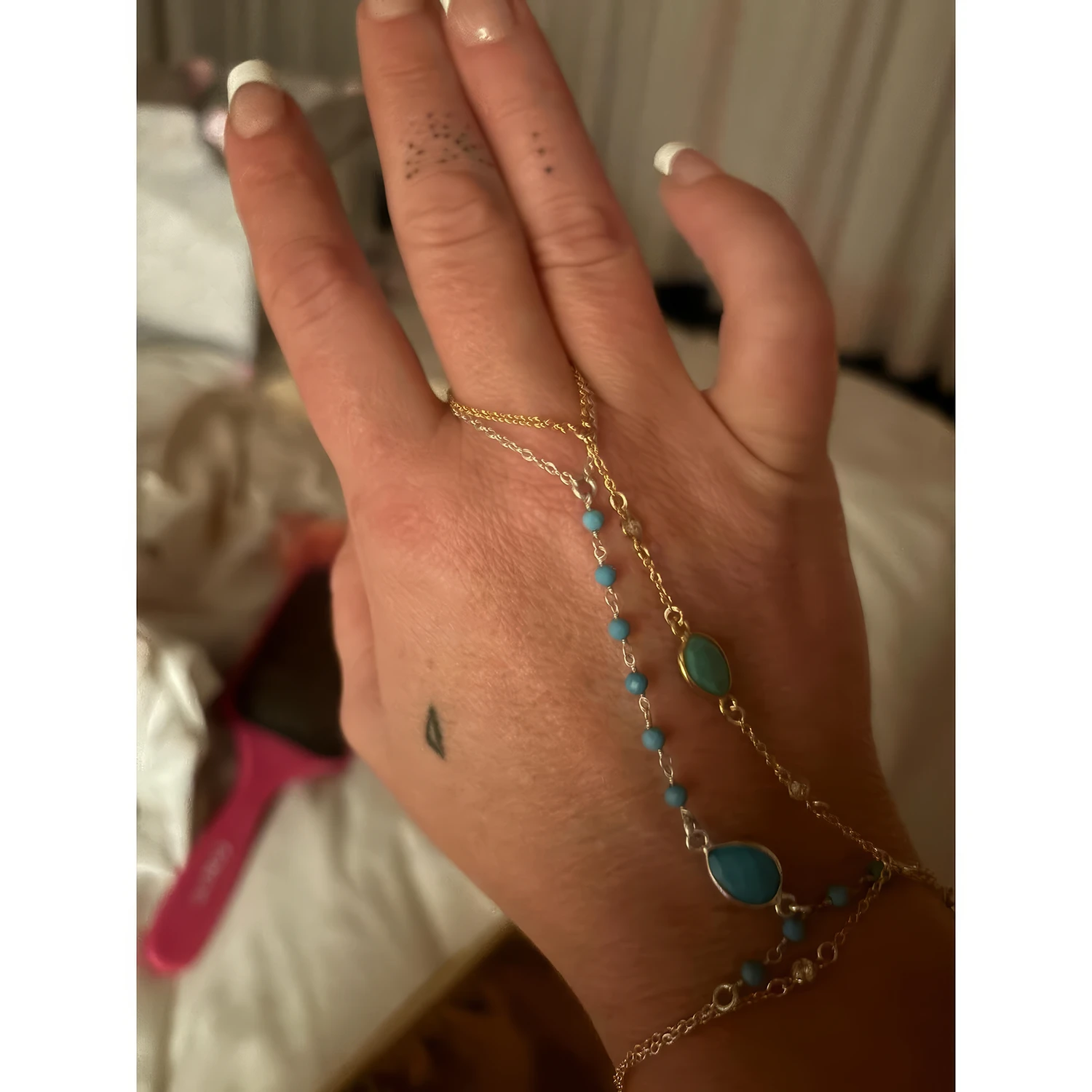 Britney Spears Will Soon Launch Her “B Tiny” Jewelry Line. News | Olertis Photo of white and yellow gold hand chains encrusted with diamonds and turquoise. Britney Spears Will Soon Launch Her “B Tiny” Jewelry Line. News