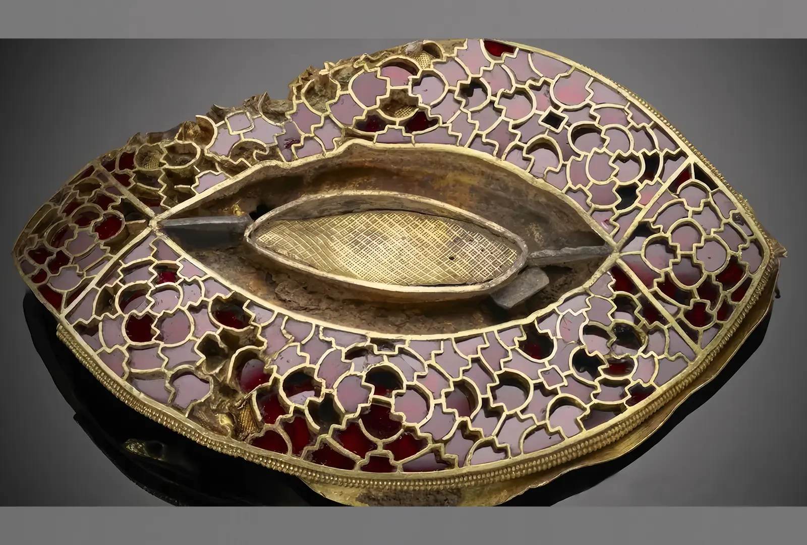 The Staffordshire Hoard: Who Buried It and Why? News | Olertis Garnet cloisonne piece with red gems set in gold partitions. The Staffordshire Hoard: Who Buried It and Why? News