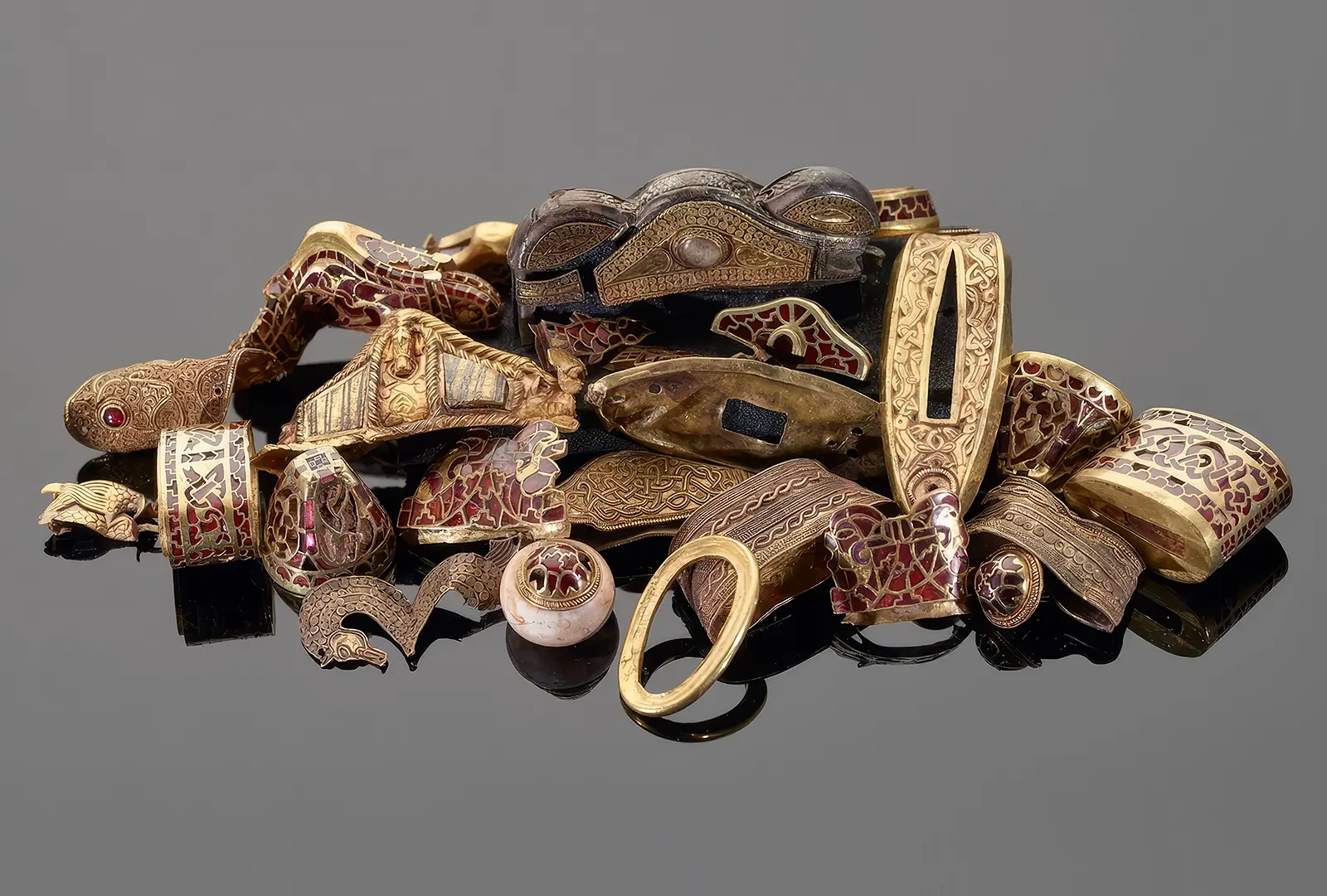 The Staffordshire Hoard: Who Buried It and Why? News | Olertis Garnet cloisonne pieces with red gems set in gold partitions. The Staffordshire Hoard: Who Buried It and Why? News