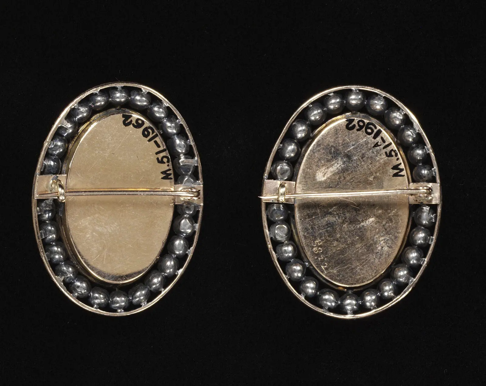Bracelet clasps. At that time, bracelets were commonly worn in pairs. Each clasp would adorn a wrist, serving as a decorative fastener for bracelets likely made from multiple strands of large pearls. View of the clasp from the back. Marie Antoinette Style: Will The Queen’s Elegance Ever Shine Again? News