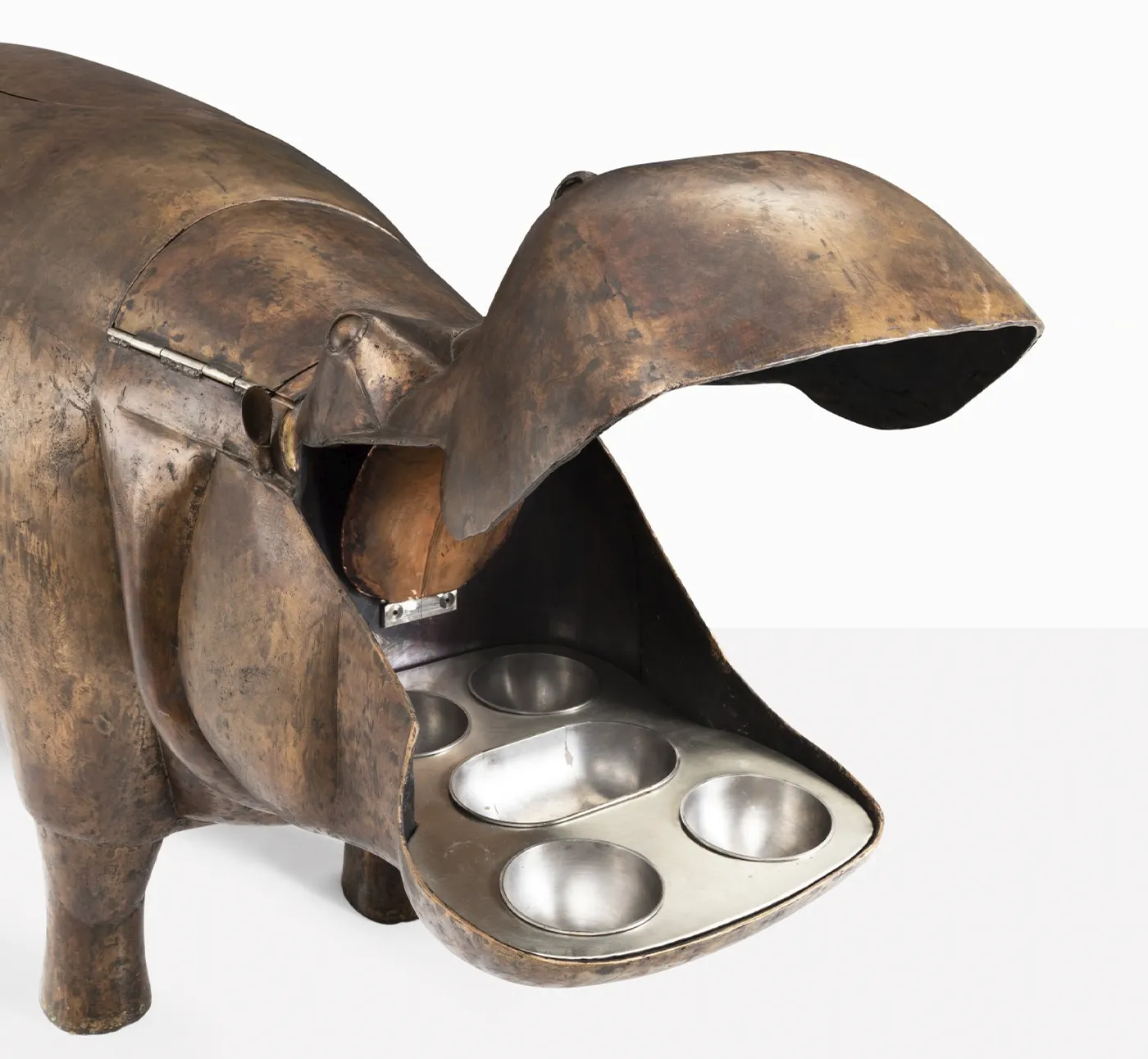 Sotheby’s Will Auction Anne Schlumberger’s Collection of Jewelry & Art. News | Olertis A 1976 bar sculpture by François-Xavier Lalanne, crafted from copper, nickel silver, stainless steel, brass, and painted wood, shaped as a hippopotamus. The bar is full and open. The open mouth of a hippopotamus bar. Sotheby’s Will Auction Anne Schlumberger’s Collection of Jewelry & Art. News