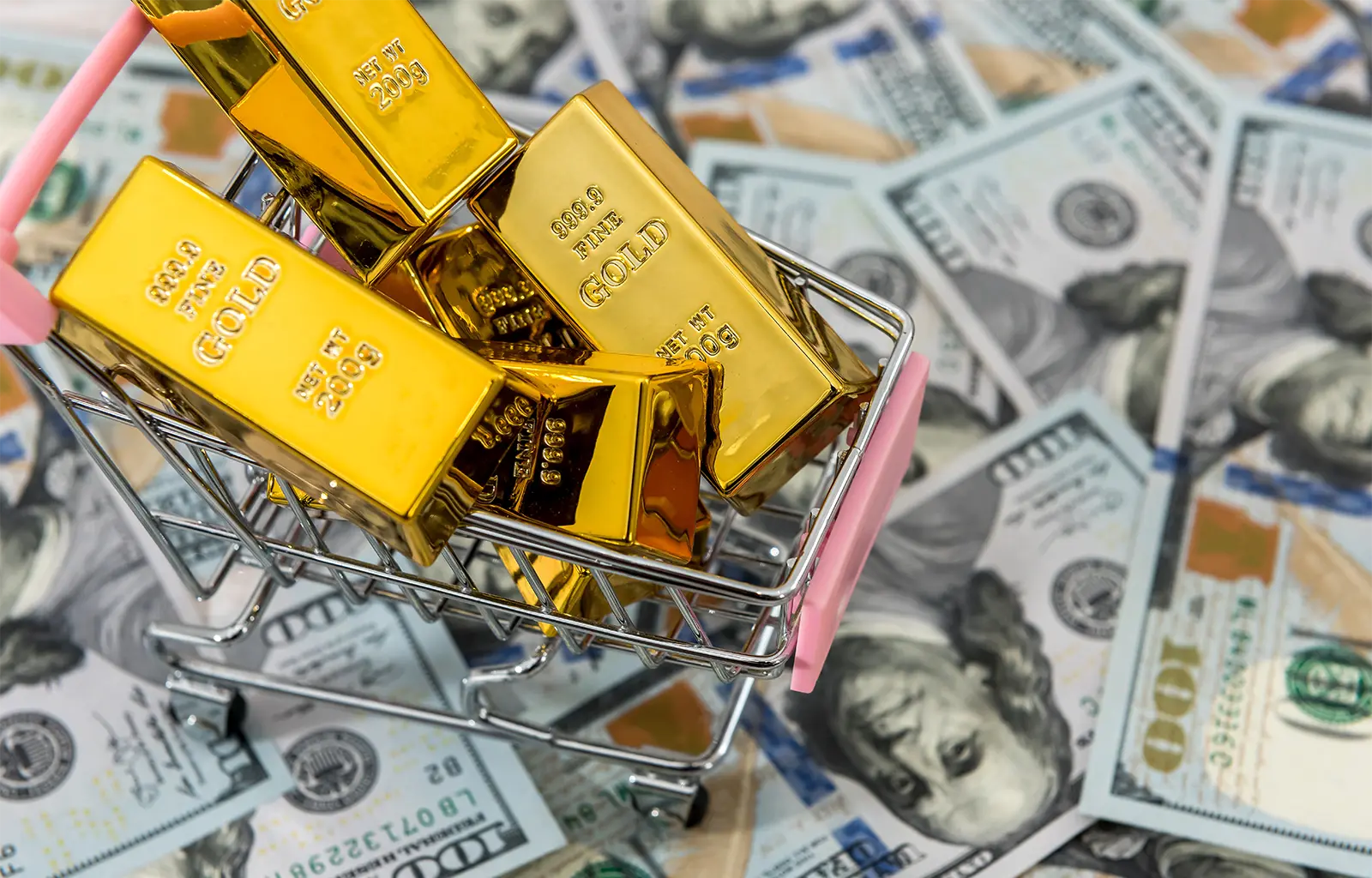 The WGC Has Proposed to Digitize Gold. News | Olertis Gold bars are in a shopping cart. The cart is standing on dollars. The WGC Has Proposed to Digitize Gold. News