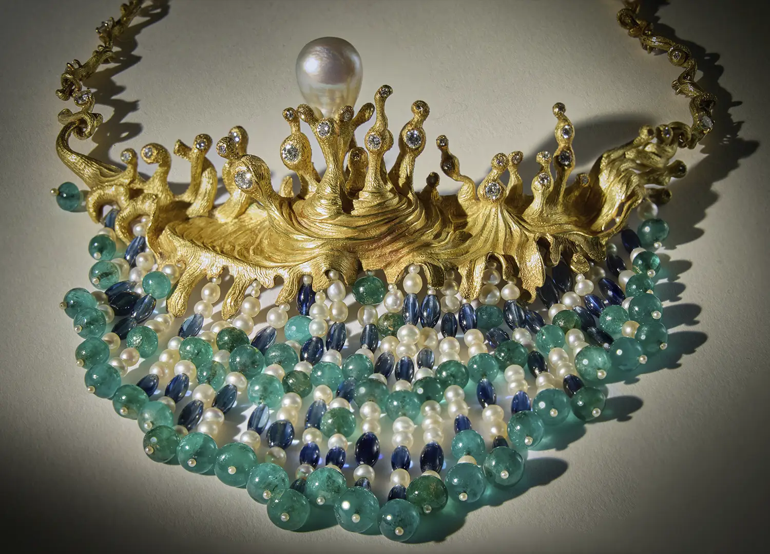 Sotheby’s Will Auction Anne Schlumberger’s Collection of Jewelry & Art. News | Olertis The Salvador-Dalí-styled Swirling Sea custom necklace. Its untraditional design features pearls, sapphires, diamonds, and emeralds. It was designed in 1954 and was made from 18k gold by Carlos Alemany a decade later in New York. Side view. Sotheby’s Will Auction Anne Schlumberger’s Collection of Jewelry & Art. News