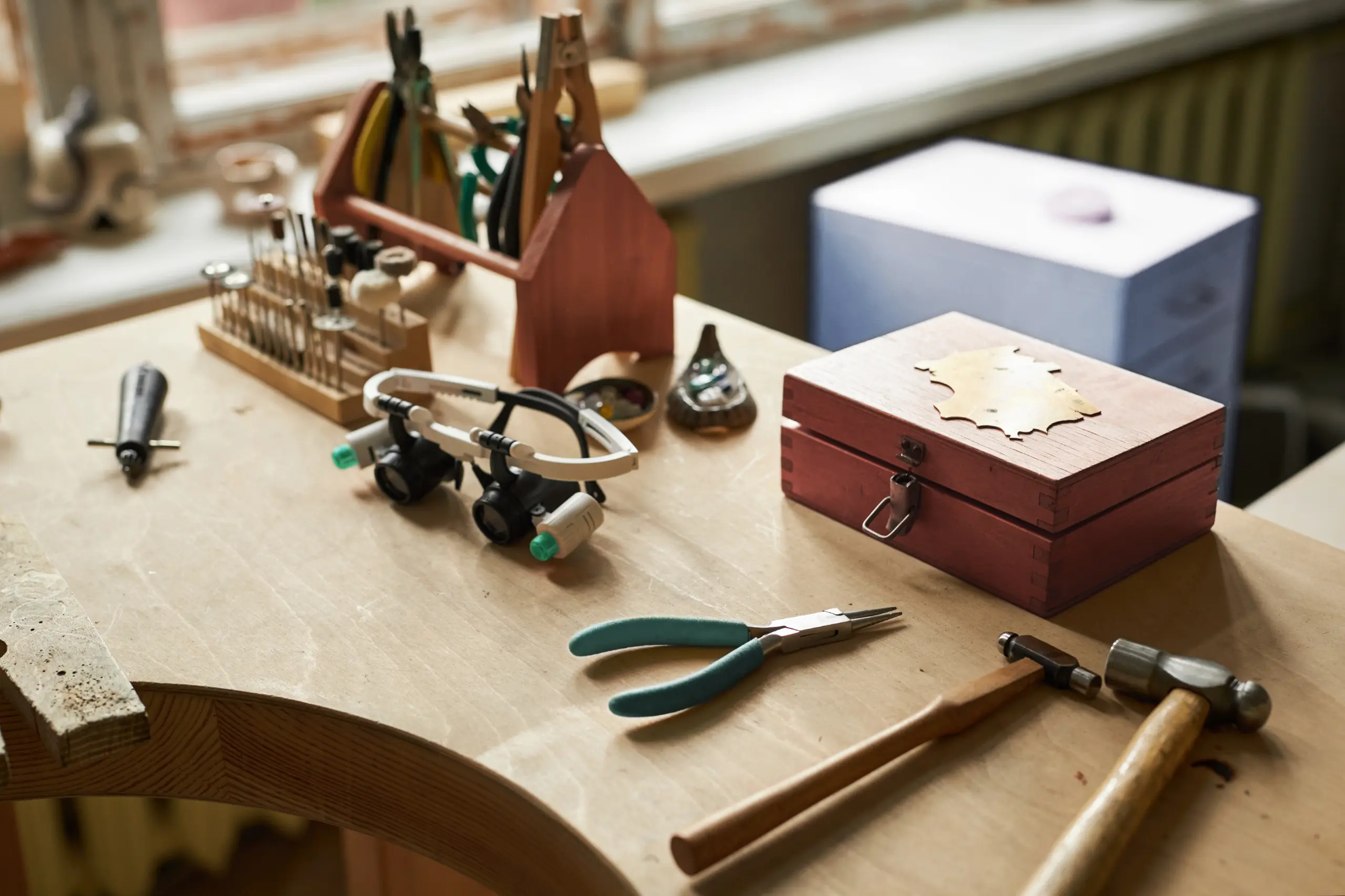 Do You Make Custom Jewelry In-House or Through Partner Studios? Olertis Olertis In-House Jewelry Production. Professional jewelry tools displayed on a master jeweler’s workbench. Do You Make Custom Jewelry In-House or Through Partner Studios? US